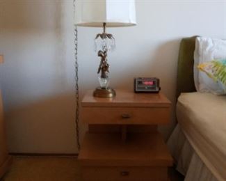 Beige wood night stand.  Glass crystal table lamp.  Part of a set including two dressers, and another nightstand.  Lamp may be purchased separately.  Clock radio not included.
