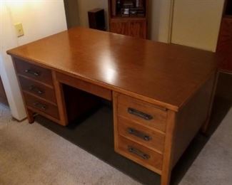 Executive desk with pull out shelves and extender board.  Top measures 60 inches by 34 inches, and 30 inches height.  Priced at $25.