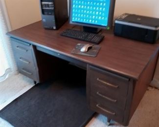 Computer desk in fair condition.  Computer, monitor, printer, mouse, keyboard, and floor mat not included.  Just the desk.  Priced at $25.