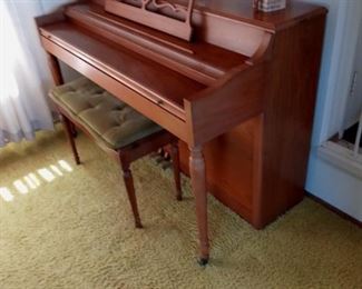 Piano with quilted bench.  Items on top shelf not included, just the piano and bench.