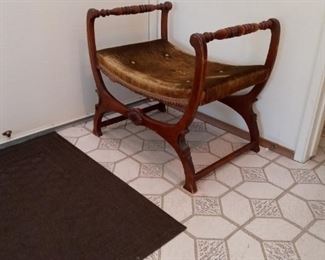 Curved bottom chair.  Used by entry door to place items before exit.  Floor mat not included.