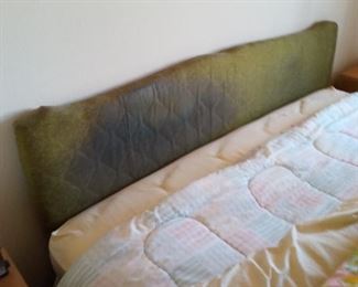 Green fabric headboard.  King size bed and frame also available for purchase.  Linens not included.
