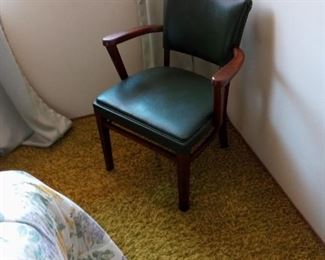 Green vinyl chair for bedroom or other locations.