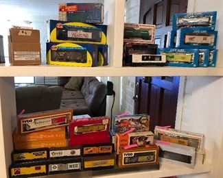 Toy trains in boxes - many beer advertising trains