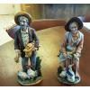 This is a pair of old country figurines in very good condition.  See pictures for details