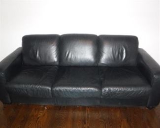 The leather couch and chair are in excellent condition.