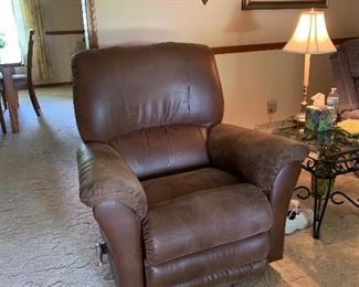 Brown rocker recliner’s two identical