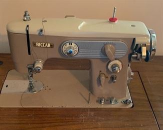 Vintage Ricardo Sewing machine in cabinet With chair