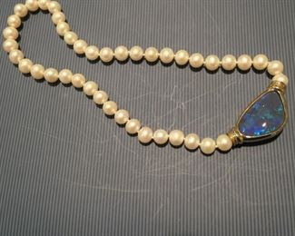 South Sea pearls with black opal pendant. Invisible clasp. Opal 32.97 carats.
