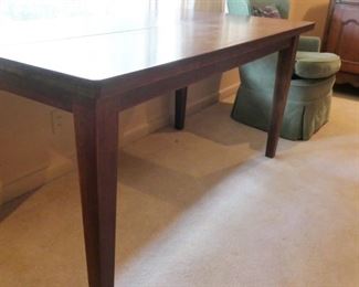 Simple library table or writing desk with streamlined style.
