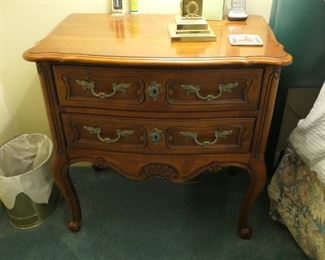 One of a pair of bedside tables. 