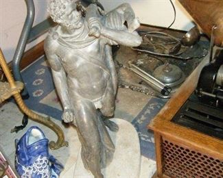 I think this was a garden ornament .He gots himself a women! 