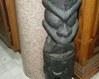 This will look good out in your garden with tall plants around it.Very heavy some kind of stone  in two parts.