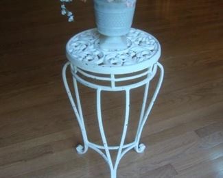 Wrought iron plant stand with white paint