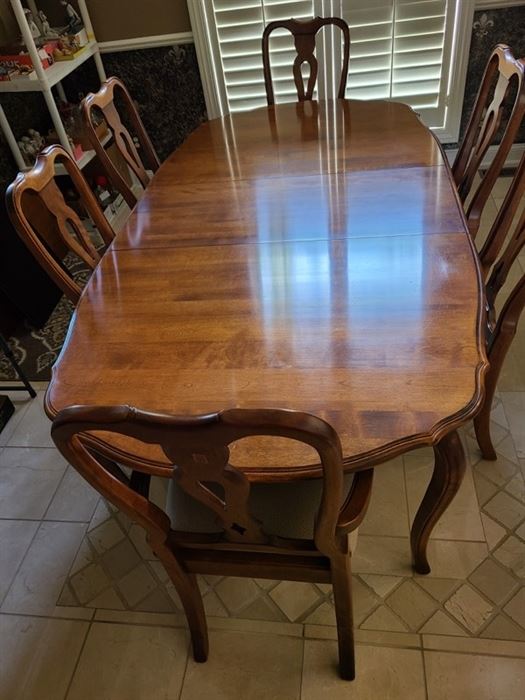 Ethan Allen Dining Table, 4 Side Chairs, 2 Arm Chairs. Table measures 84 x 44 without leaves. Adding two 18 " leaves makes it 102" long. Comes with full set of table pads.