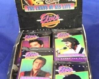 673 - Elvis Presley collector cards in store display
