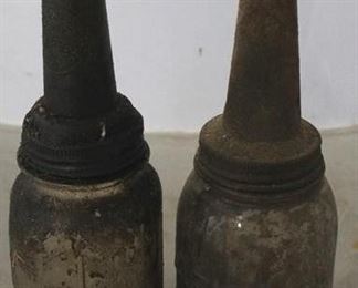 720 - 2 Antique glass oil bottles
