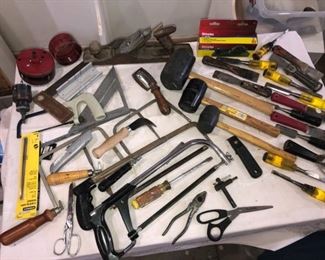Assortment of Saws Mallets Block Planers and Chisels