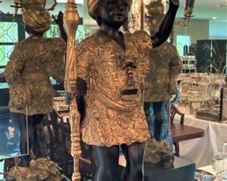 One of two elegant candle holders on pedestals 