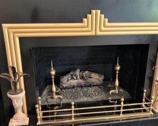 Brass fireplace fender and andirons