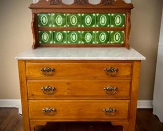 Antique chest with marble top and green tiles