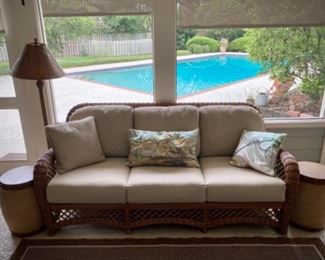 Outdoor sofa, drum end tables, wicker lamp
