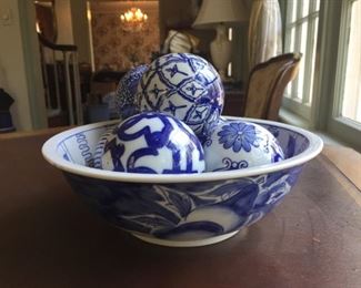 Blue and white bowl with COBALT BLUE AND WHITE CERAMIC DECORATIVE FLORAL CARPET BALLS.