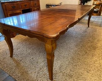 Country French Walnut Dining Table w 2 Leaves.  With scalloped  edges and a panel patterned top, this table elegantly expands with 2 leaves to accommodate all of your dinner guests.