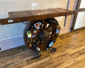 Wagon Wheel Bar Holds 6 Wine Bottle Looks like the top is the ‘tail gate’ of a stage coach