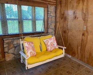 White Porch Swing with Yellow Cushions and coordinated accent pillows