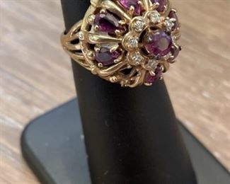 14k Gold Ring set with Rubies size 4.5 weighs 7 grams missing one stone see pictures