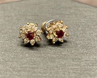 14k Gold Stud Earrings set with rubies &
sapphires total weight is 1.24 grams