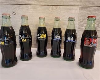 (5) Commemorative Coke Bottles NASCAR & MLB
3 Jeff Gordon, 1 Tony Stewart, and 2 The Ball Park in Arlington