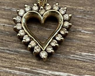 14k Gold Pendant set with sapphires weighs 2.88 grams