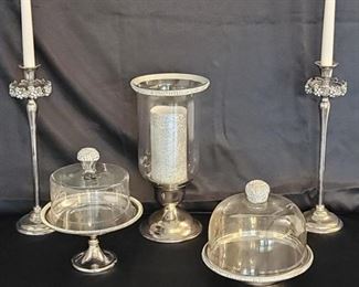 Silver Tone Elegant Dining Table Pieces includes 2 candlesticks, 2 covered cheese plates (one is footed), and a pillar candlestick. 1 piece is Rachel Zoe