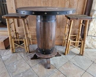 Round Barrel Style Table w 2 Bamboo leg Barstools
Table 31 1/2in diameter x 34in t
At stools 14in sq x 29in t