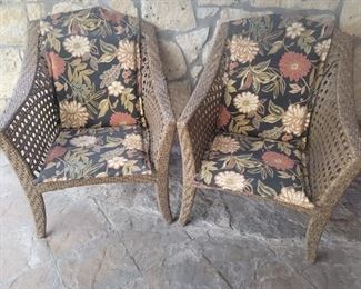 (2) Outdoor Wicker Chairs with Floral Cushions are 28in w x 38in t