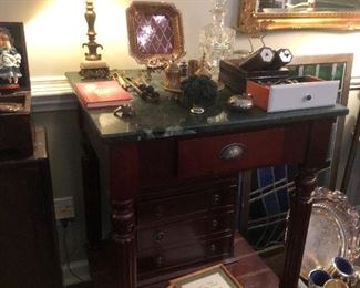 Marble top table, bar tools and book, kaleidoscope, tons of silver plated items.