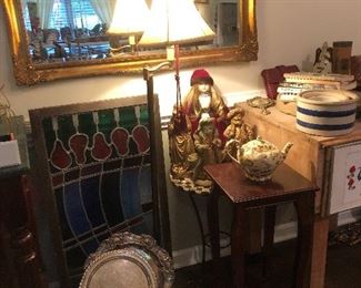 Gorgeous stained glass, gold mirror, side tables, stand alone kitchen butcher block, cookbooks 