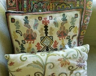 Several embroidered silk pillows