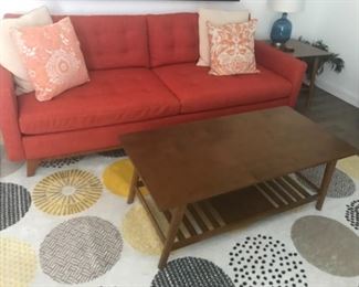 Brown coffee table $40 
Orange sofa $195
Rug yellow and grey $50