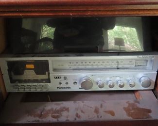Stereo inside music cabinet.