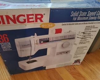 Singer sewing machine in box