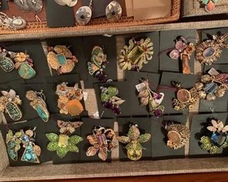 Sterling silver pendants by Native American artist Thane DeLeon with genuine gemstones and turquoise where applicable. All 50% off!