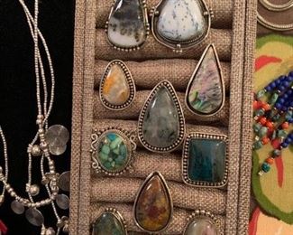 Statement rings from Tibet with genuine stones. The metal is silver with a touch of brass mixed in to retard tarnishing. They are very comfortable to wear. All 50% off!