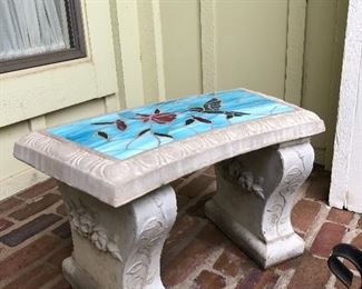 Stone bench with decorative seat