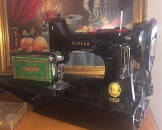 Singer “Featherweight” sewing machine with case. 