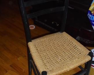 One single ladder back chair w/woven rope seat