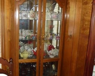 7' tall curio 3 sided (corner piece) w/mirrors on all sides, 3 glass shelves,1 wood shelf, & double glass doors