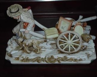 Porcelain figurine of old man pulling cart